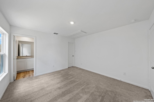 unfurnished room with light colored carpet