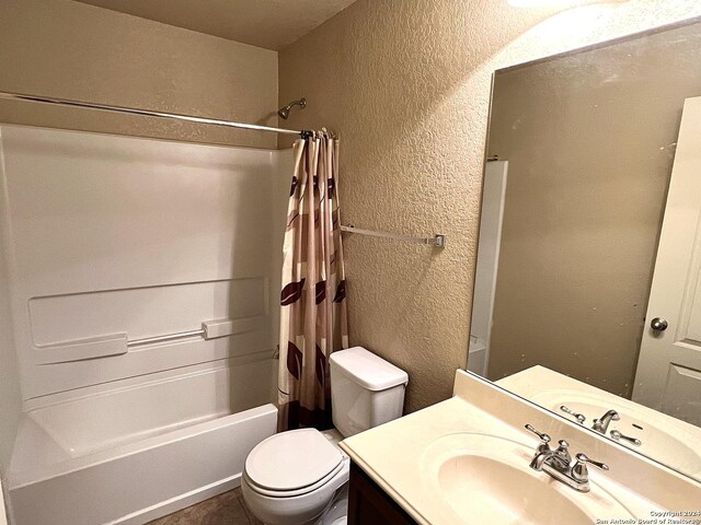 full bathroom featuring vanity, toilet, and shower / bath combination with curtain