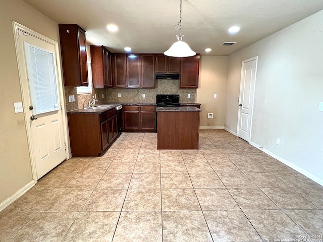 kitchen featuring backsplash, a center island, stove, and light tile patterned floors