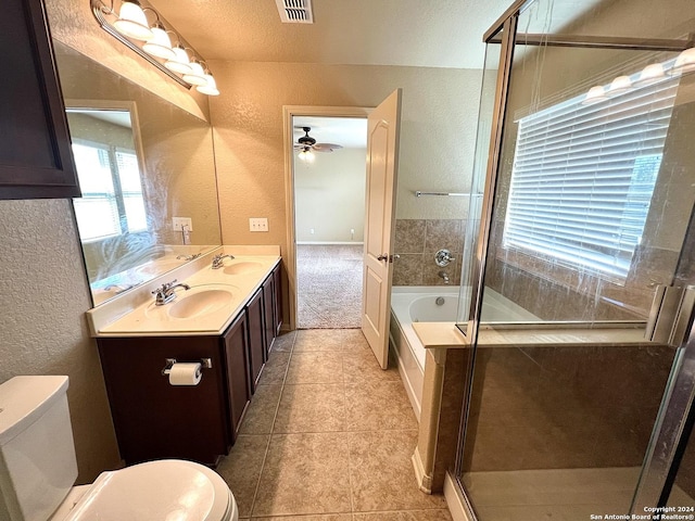 full bathroom featuring toilet, ceiling fan, plus walk in shower, tile patterned floors, and vanity