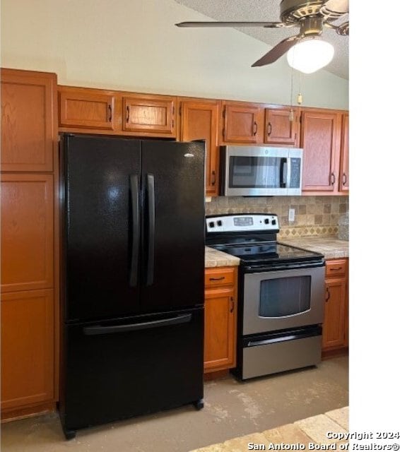 kitchen with light tile patterned flooring, tasteful backsplash, ceiling fan, and stainless steel appliances