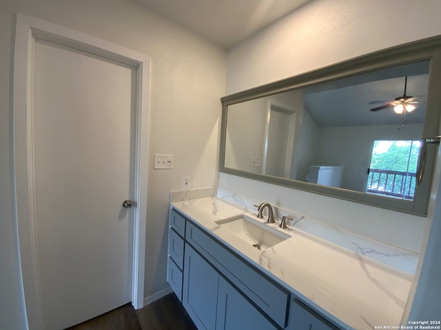 bathroom with vanity, ceiling fan, and hardwood / wood-style flooring