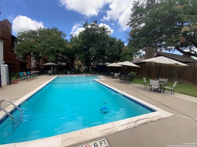 view of swimming pool with a patio area