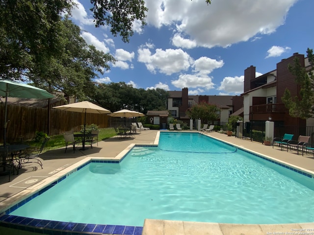 view of swimming pool with a patio area