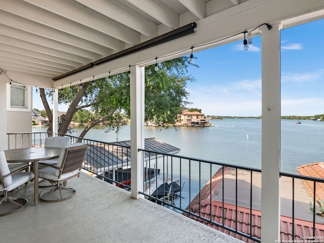 balcony featuring a water view