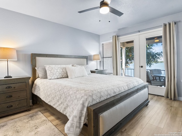 bedroom featuring french doors, access to outside, ceiling fan, and light hardwood / wood-style floors