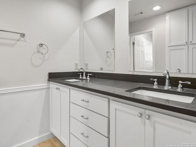 bathroom featuring vanity and wood-type flooring