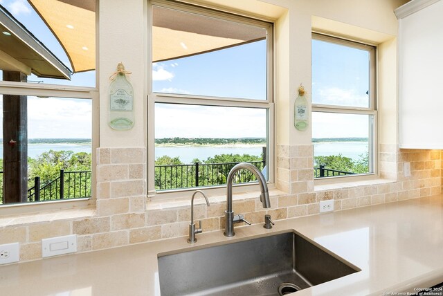 laundry room featuring washer and clothes dryer and cabinets