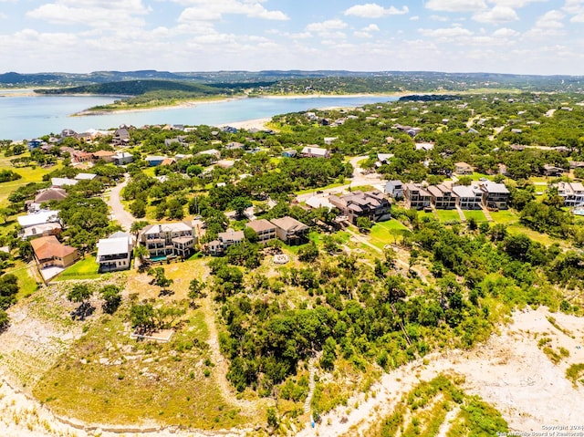 birds eye view of property featuring a water and mountain view