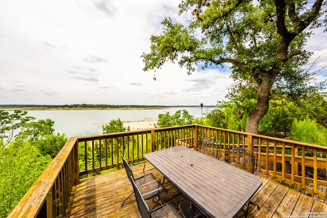 wooden deck with a water view