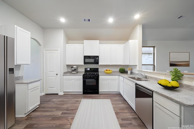 kitchen with white cabinetry, dark hardwood / wood-style floors, sink, and black appliances