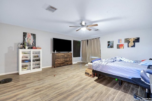 bedroom featuring hardwood / wood-style flooring and ceiling fan