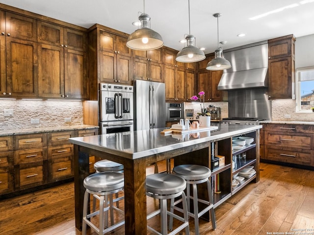 5 Old Fredericksburg, Boerne, TX 78015 - kitchen with open shelves, wall chimney exhaust hood, appliances with stainless steel finishes, and dark wood-style floors