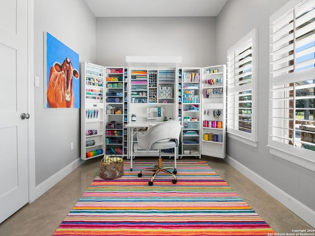 home office featuring concrete flooring