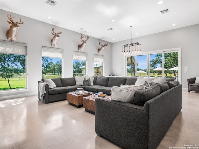5 Old Fredericksburg, Boerne, TX 78015 - living area featuring a healthy amount of sunlight, concrete flooring, and recessed lighting