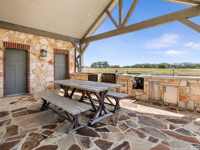 view of patio / terrace with area for grilling and a gazebo