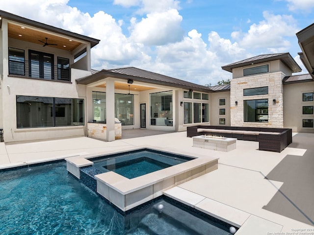 exterior space with a patio, a pool with hot tub, pool water feature, ceiling fan, and an outdoor living space