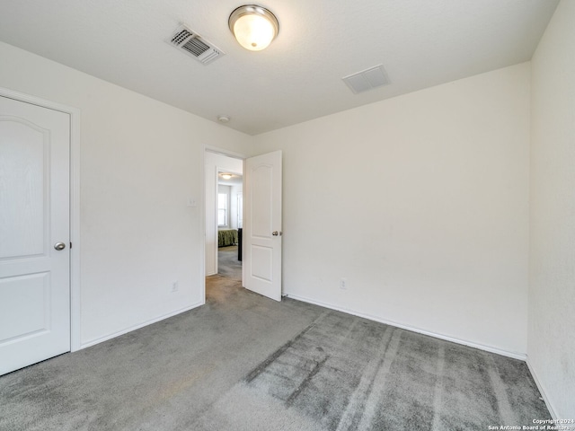 spare room featuring carpet flooring