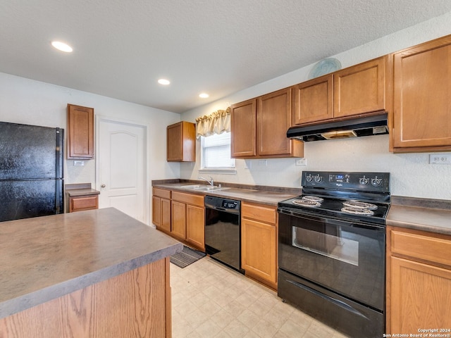 kitchen with sink and black appliances