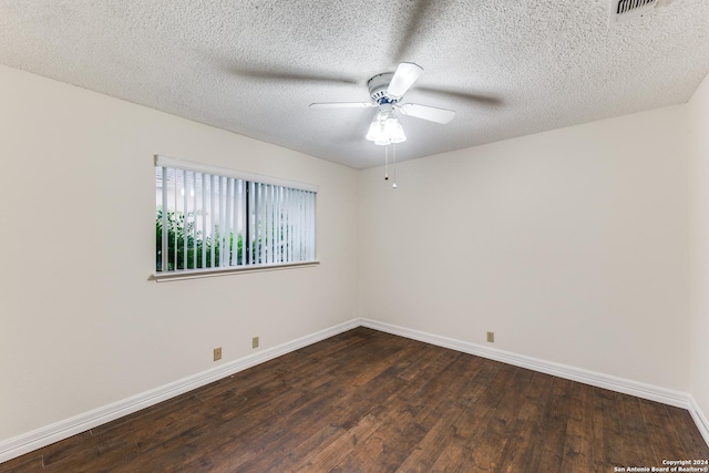 spare room with dark wood-type flooring, a textured ceiling, and ceiling fan