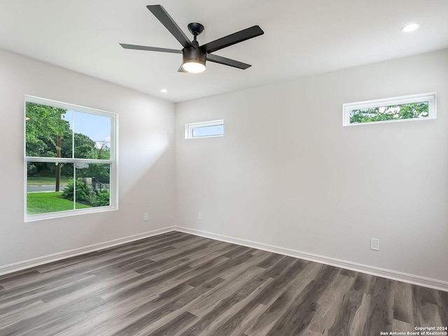 empty room featuring ceiling fan and dark wood-type flooring