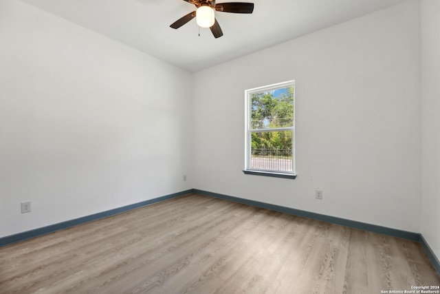 unfurnished room with light hardwood / wood-style floors and ceiling fan