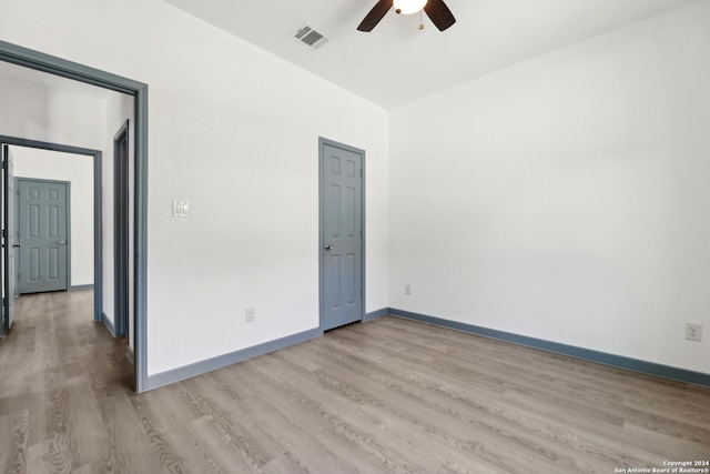 unfurnished room featuring wood-type flooring and ceiling fan