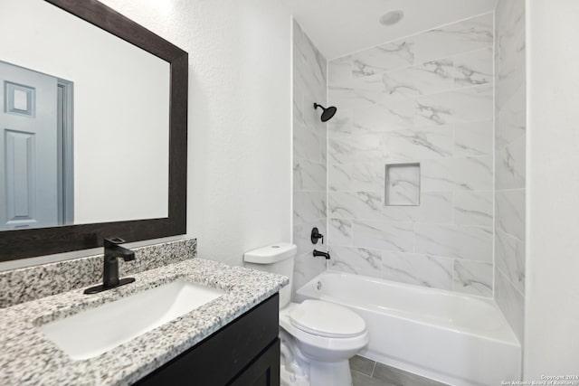 full bathroom featuring vanity, toilet, and tiled shower / bath