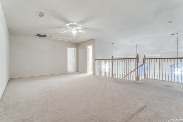 carpeted empty room featuring ceiling fan