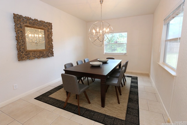 tiled dining space with a notable chandelier