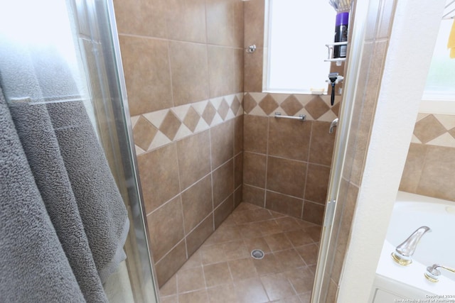 bathroom with a shower stall and a garden tub