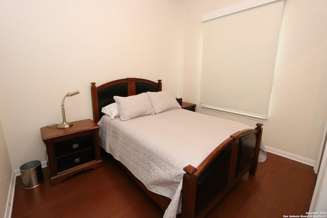 bedroom featuring dark hardwood / wood-style floors