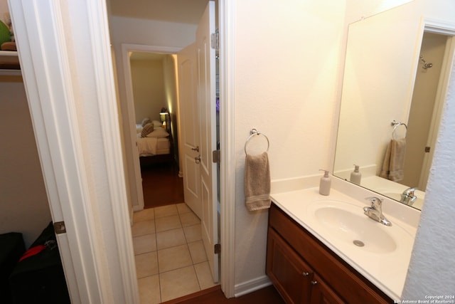 bathroom with tile patterned floors and vanity