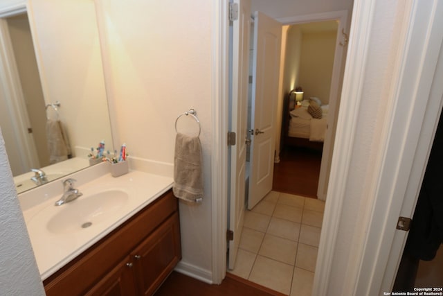 bathroom with vanity and tile patterned flooring