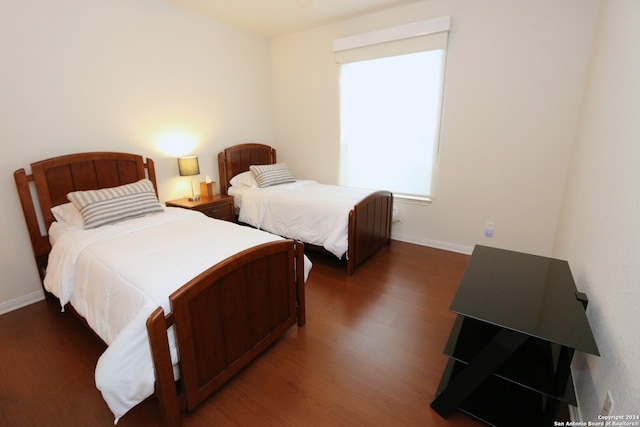 bedroom featuring dark hardwood / wood-style floors