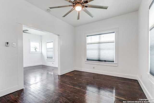 unfurnished room featuring ceiling fan and dark hardwood / wood-style floors