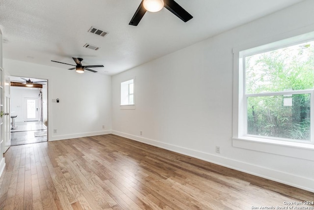 unfurnished room with light hardwood / wood-style flooring