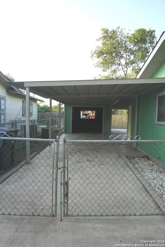 exterior space with a carport