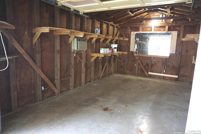 garage with a wall mounted air conditioner