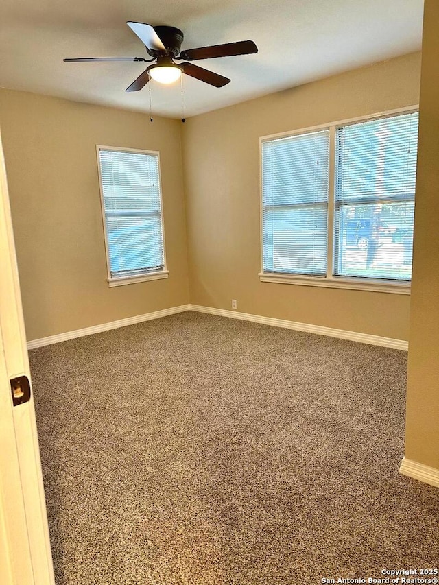 411 W Hart Ave, San Antonio, TX 78214 - spare room featuring baseboards, a healthy amount of sunlight, ceiling fan, and carpet floors