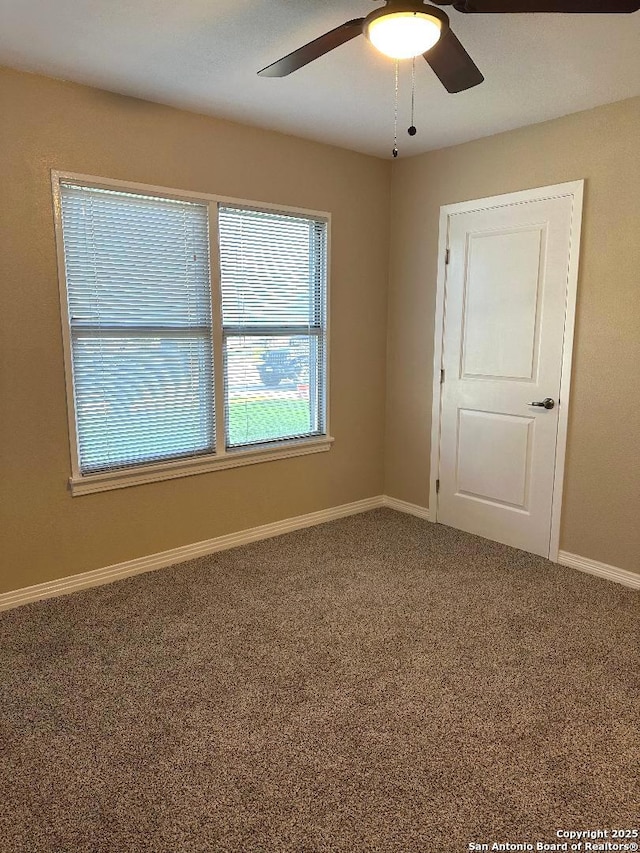 411 W Hart Ave, San Antonio, TX 78214 - unfurnished room with carpet, baseboards, and a ceiling fan