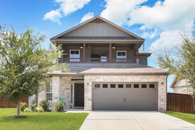 craftsman-style house featuring a garage, a front lawn, and ceiling fan