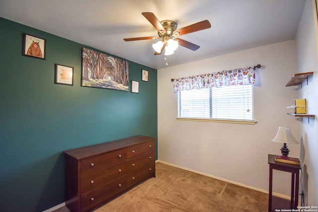 carpeted bedroom with ceiling fan