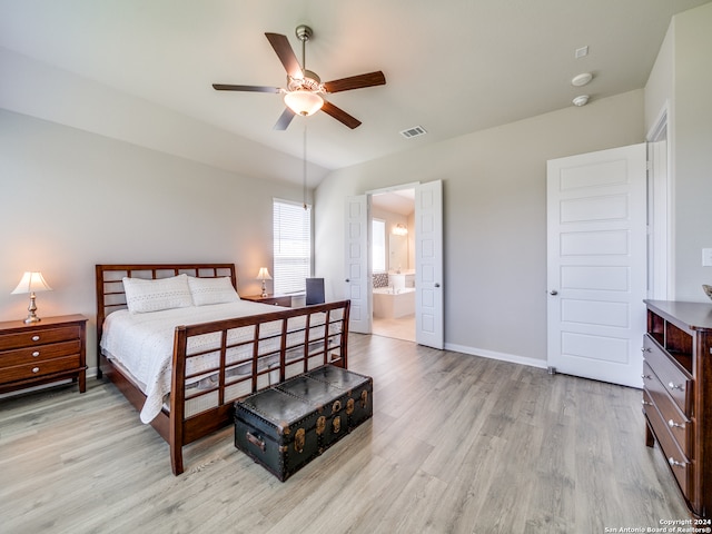 bedroom featuring light hardwood / wood-style floors, ensuite bath, and ceiling fan