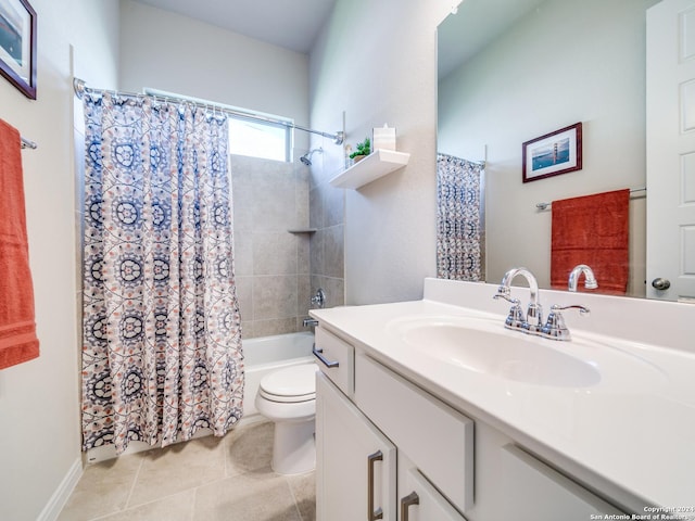 bathroom with shower / bathtub combination with curtain, vanity, toilet, and tile patterned floors