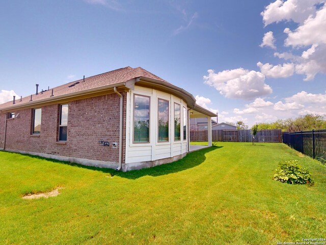 view of home's exterior featuring a yard