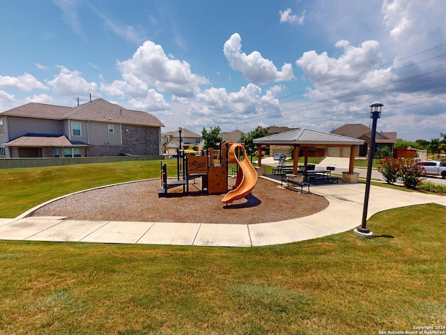 view of playground with a yard and a gazebo