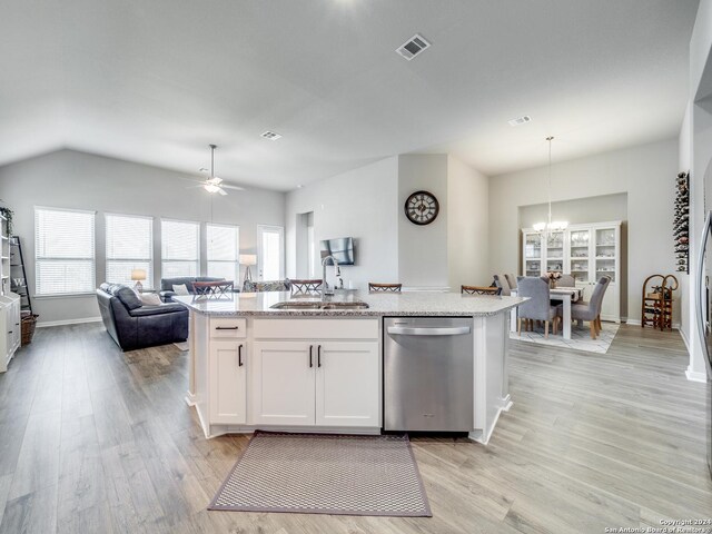 kitchen featuring light hardwood / wood-style flooring, white cabinets, sink, a healthy amount of sunlight, and stainless steel dishwasher