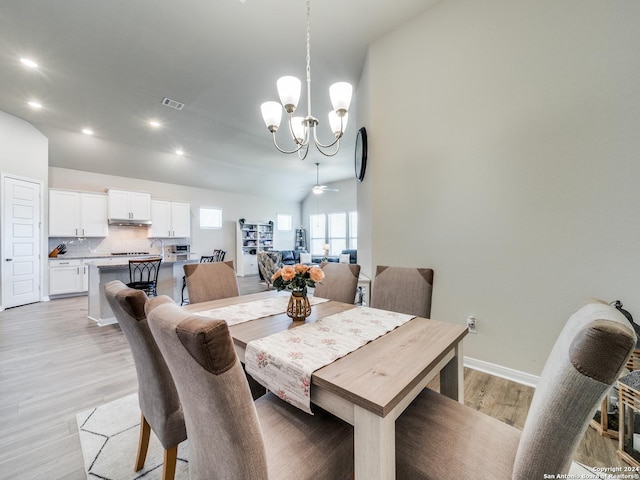 dining space featuring recessed lighting, ceiling fan with notable chandelier, visible vents, baseboards, and light wood-style floors