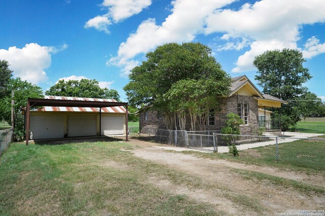 view of front of property with a garage and a front yard